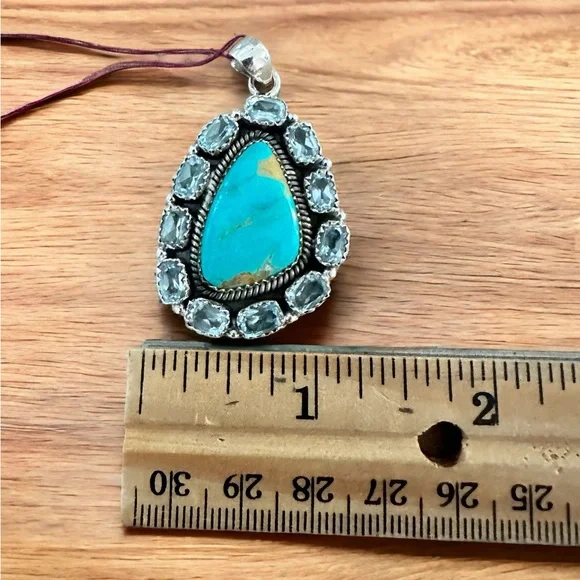 Turquoise Surrounded by Blue Topaz in Sterling Silver